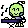 a pixel art illustration of a green skull sitting on a table .