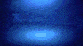 a whale is swimming in the ocean with a light coming out of its mouth