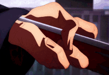a close up of a person 's hands holding a knife