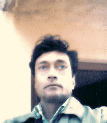 a man is taking a picture of himself with a blurred background