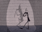 a cartoon of a man dancing in front of a brick wall with his shadow projected on the wall .