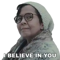 an elderly woman wearing glasses and a fur coat says i believe in you