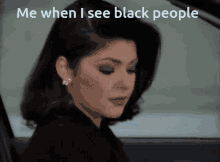 a woman is sitting in a car with the words me when i see black people above her
