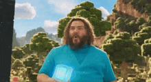 a man in a blue shirt is holding a blue cube in his hand