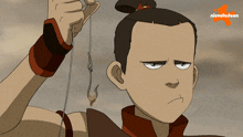 a cartoon character holding a hook with nickelodeon written on the bottom