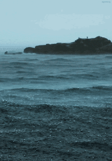 a person standing on a rock in the middle of a large body of water with the words agreeing below them