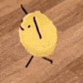 a cartoon drawing of a lemon with arms and legs walking on a wooden floor .