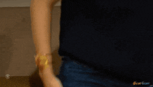 a person 's arm is shown in a blurry photo with a cbs logo in the corner