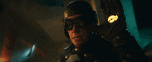 a man wearing a helmet and goggles has a watch on his left hand