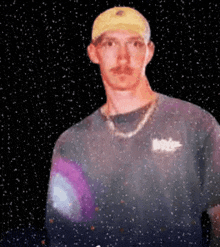 a man wearing a yellow hat and a t-shirt that says ' abercrombie & fitch ' on the front