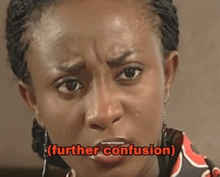 a close up of a woman 's face with the words `` further confusion '' written on the bottom .