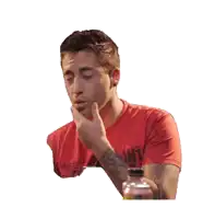 a man in a red shirt with the word uni on the front