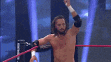a wrestler in a ring with the word sarrett on the ring