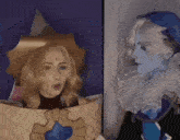 a woman is standing next to another woman in a costume .