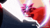 a cartoon character with red hair is fighting another character with a white light coming out of his mouth .