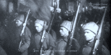 a black and white photo of soldiers with the words " and the young october is ahead " at the bottom