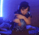 a man wearing headphones and a tie dye shirt is dancing in a room .