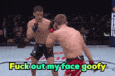 a boxing match with the words fuck out my face goofy in the corner