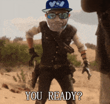 a man wearing sunglasses and a hat with the words you ready on it