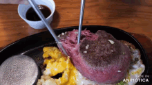 a close up of a plate of food that says made in animotica on the bottom
