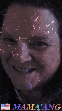 a close up of a woman 's face with the word mama ang on the bottom right