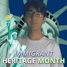 a man with glasses stands in front of the statue of liberty and the words immigrant heritage month