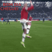 a soccer player is jumping in the air with the words bom dia cheguei in red