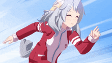 a girl in a red and white striped jacket with the letter t on it