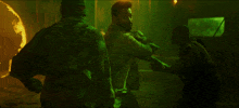 a man in a green shirt with the number 19 on it fighting another man