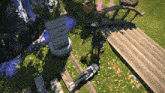 a person is laying on the grass next to a bridge