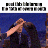 a picture of a seal licking a man 's face with the words post this binturong the 15th of every month
