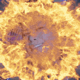 a person 's face is surrounded by flames and smoke