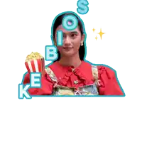 a sticker of a woman holding a box of popcorn with the words ke bioskop yuk below her
