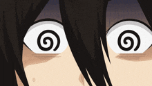a close up of a person 's eyes with a swirl in them