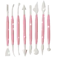 a row of pink and white plastic utensils on a white surface