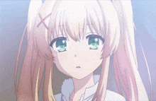 a girl with blonde hair and green eyes has a red x on her head