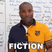 a man standing in front of a whiteboard with the word fiction on it