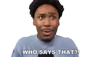 a man in a blue shirt is smiling and says " who says that "