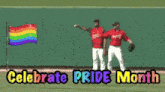 two baseball players celebrate pride month on a field