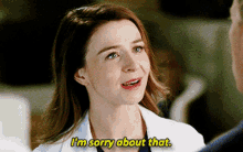 a woman in a white coat is talking to a man and says i 'm sorry about that
