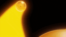 a yellow light is shining on a black background with a sphere in the foreground