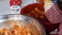 a bag of white sugar sits on a table next to a bowl of food