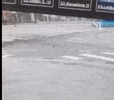 a blurry picture of a street with a sign that says ' video extrapath '
