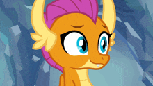 a close up of a cartoon character with blue eyes and horns