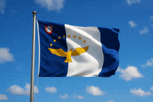 a blue white and yellow flag with a yellow bird on it