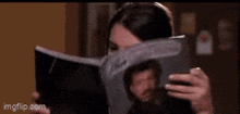 a woman is reading a book titled the very strange life of lionel richie