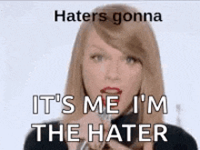 a woman is talking into a microphone with the words `` haters gonna it 's me i 'm the hater ''