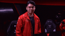 a man wearing a red jacket that says lck