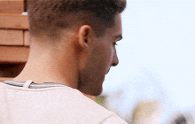 a close up of a man 's neck and head