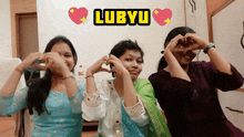 three girls are making a heart shape with their hands and the words lubyu are above them